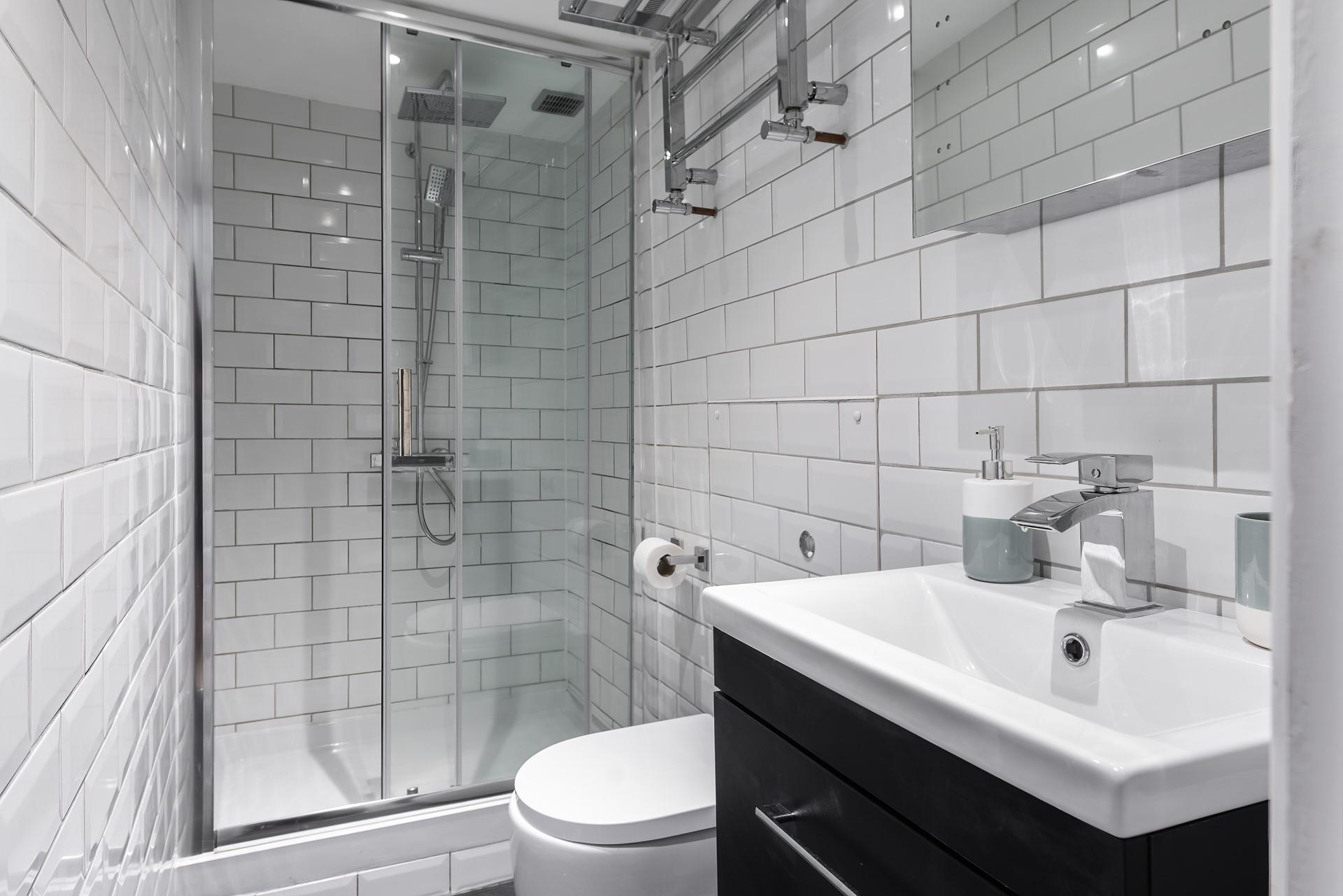 Wash off sandy toes under the luxurious rainhead shower.