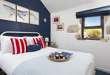 Bedroom 1 has a comfortable double bed and looks out to the garden.