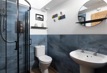 Contemporary and chic, the wet room has a walk-in shower.