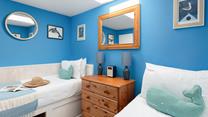 Bedroom 2 has built-in twin beds, suitable for children only.
