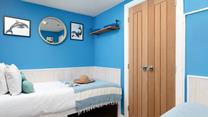 Stylish coastal artwork is dotted throughout the cottage.