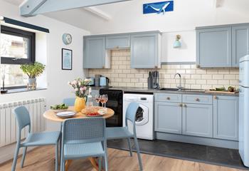 The kitchen has all you need for a relaxing stay.
