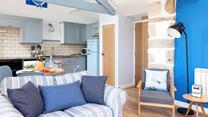 Shades of blue reflect the coastal location.