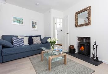 The sitting room is light and cosy, perfect for all seasons.