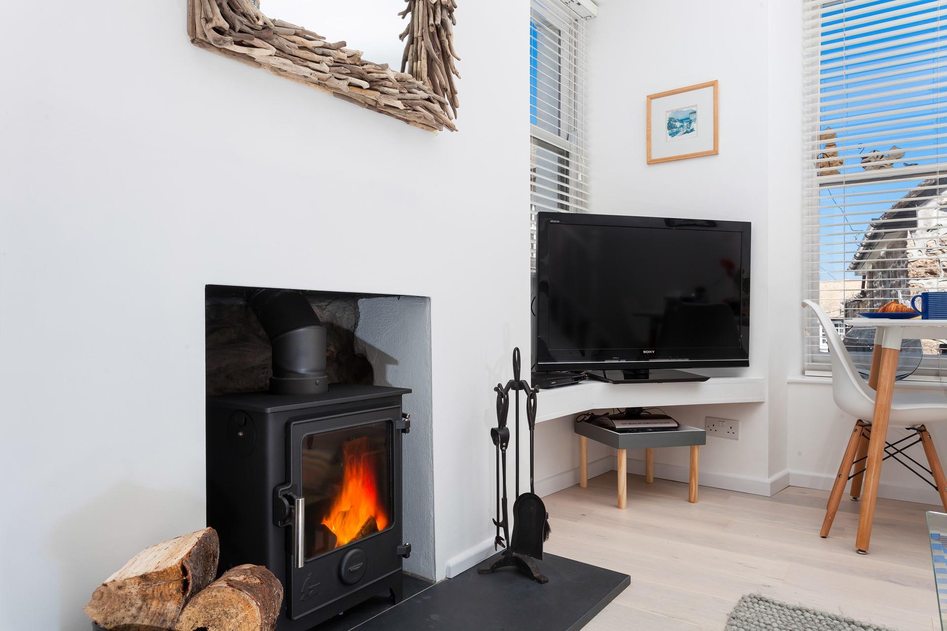 Cosy up next to the wood burner on a chilly evening.