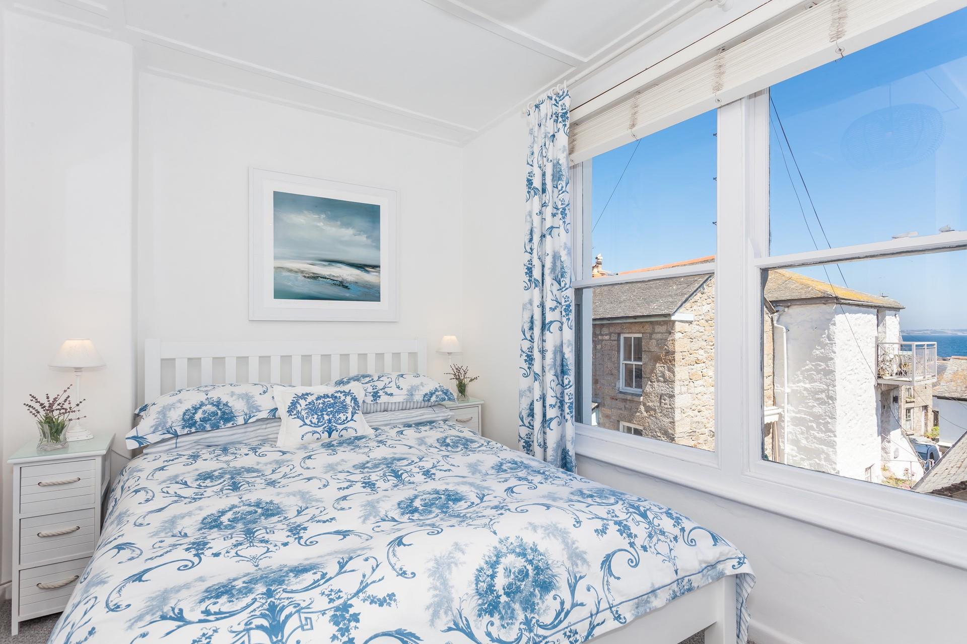 Bedroom 1 has sea glimpses to wake up to.