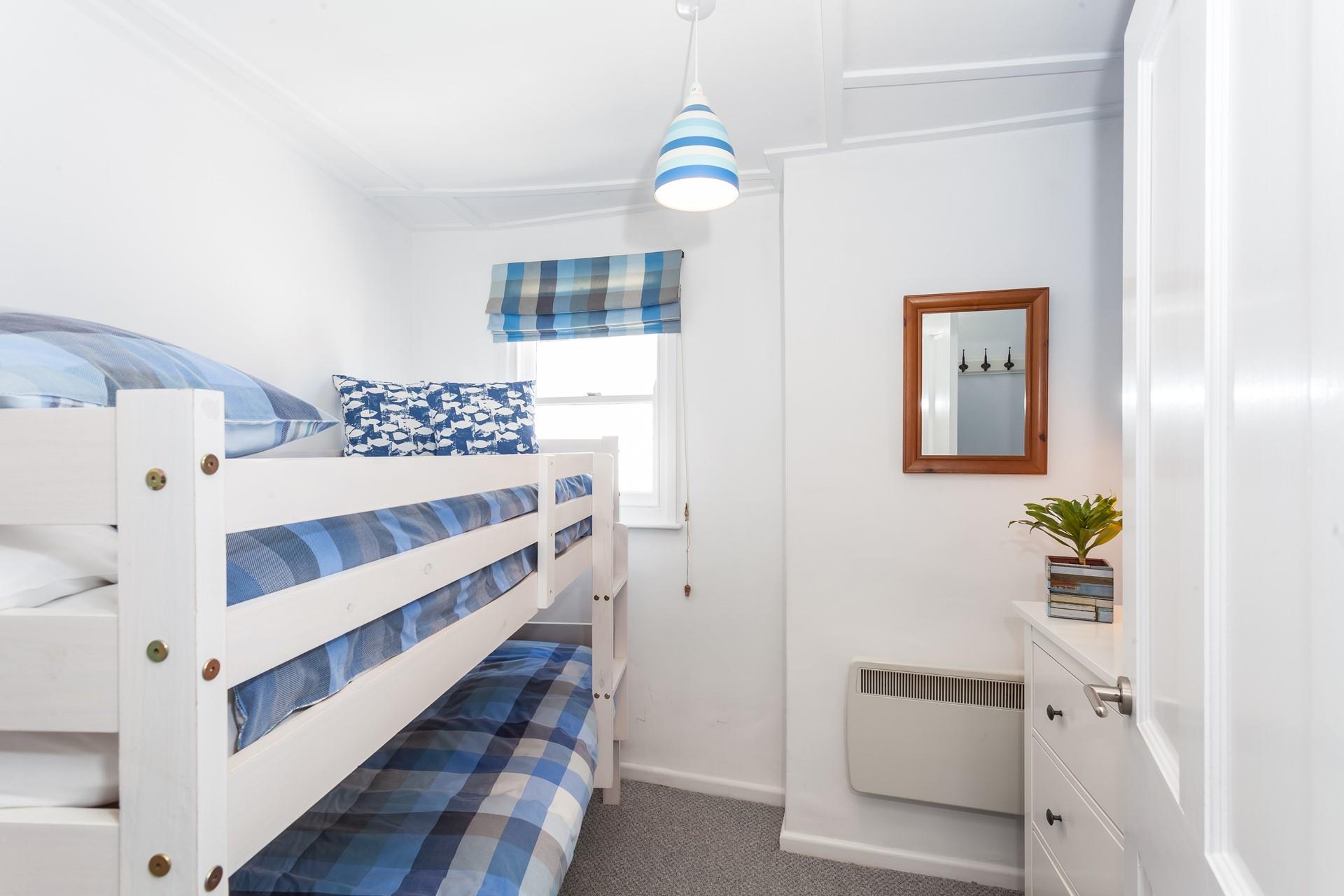 The bunk bedroom is perfect for the kids.