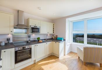 Enjoy the view while preparing food for the day in the fully-equipped kitchen.