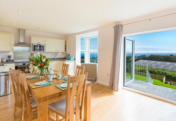 The bright and airy kitchen/diner benefits from large patio doors and a bay window, taking full advantage of the stunning countryside and sea views. 