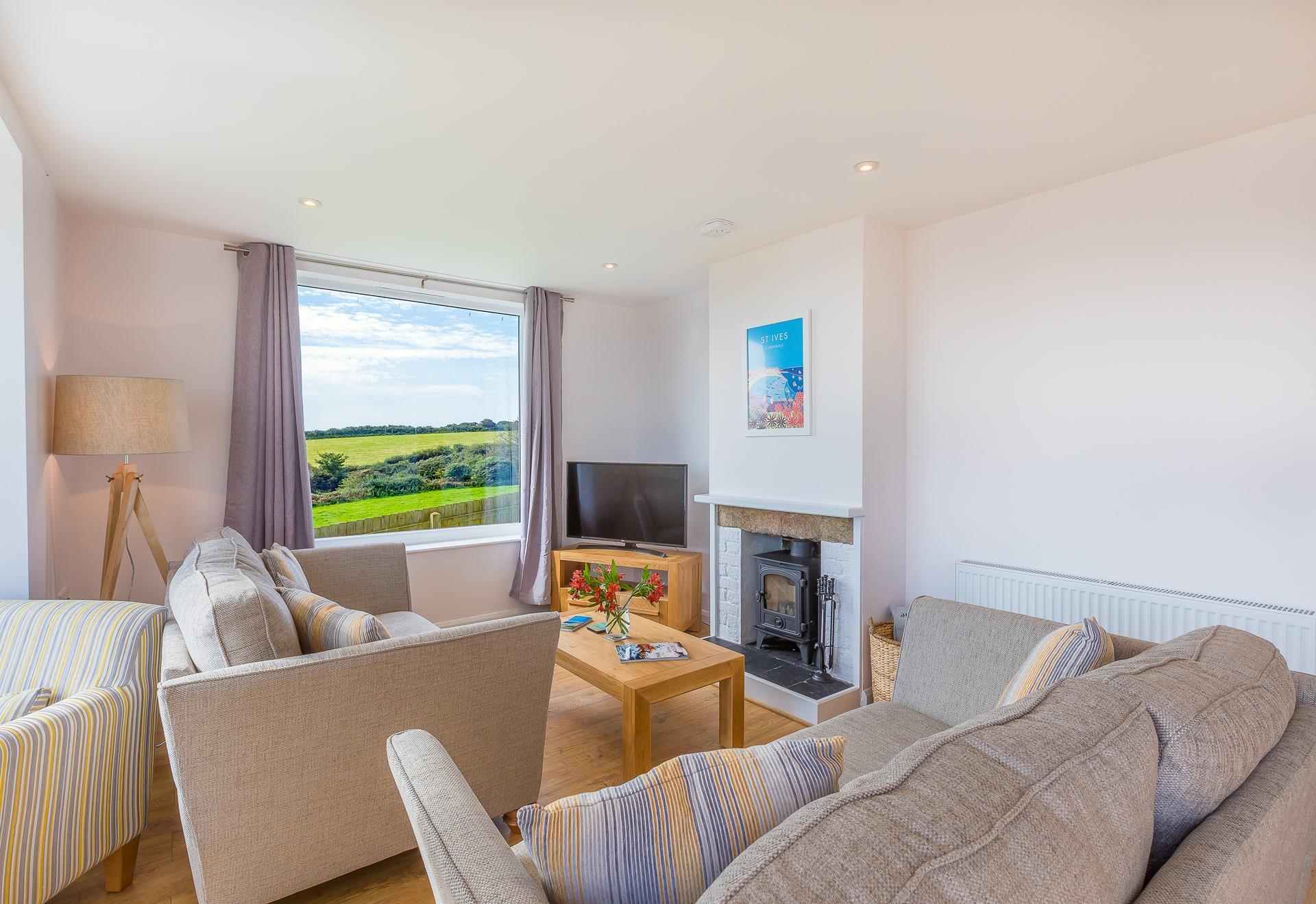 Light the wood burner, pour yourself a drink and snuggle up on the sofas together.