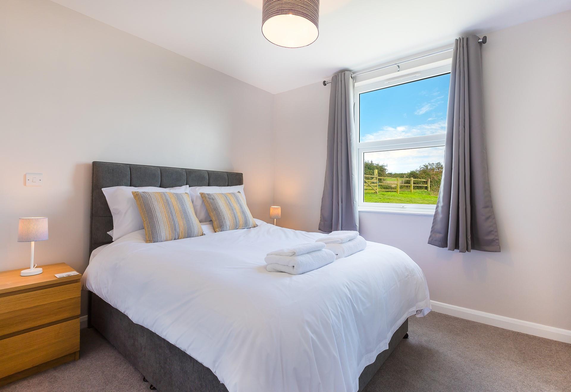 Wake up to glorious countryside views after a comfortable sleep in the king size bed. 