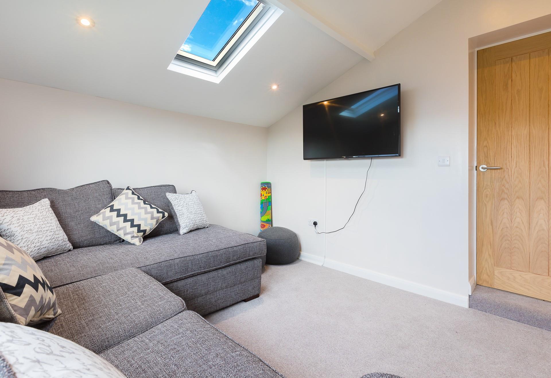 Let the kids escape to the snug for some chilled out TV time. 