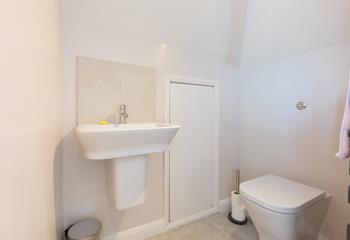Bedroom 1 has a convenient ensuite cloakroom with WC and washbasin.
