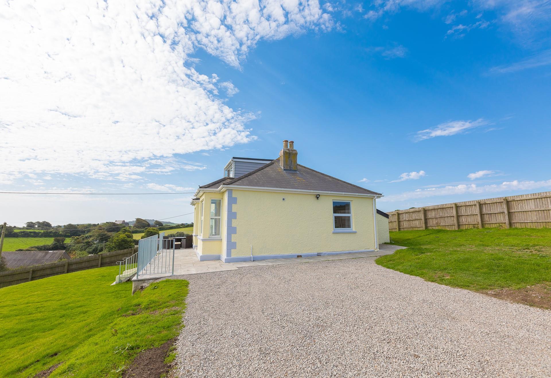 There's plenty of parking on the gravel driveway adjacent to the property, providing level access when unloading from the car.