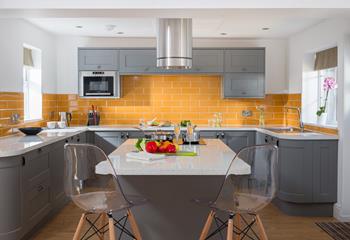 You'll love the bright and colourful kitchen. 