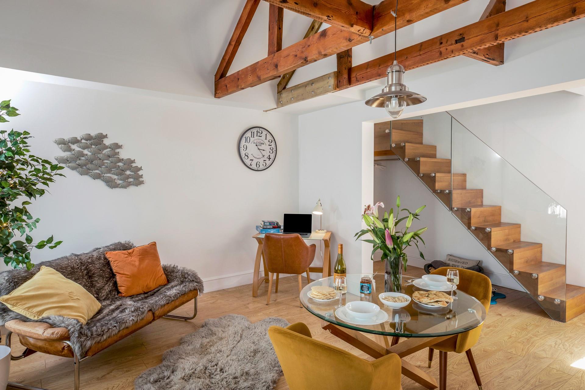 Thoughtfully designed, the open plan vaulted living area is filled with natural light. 