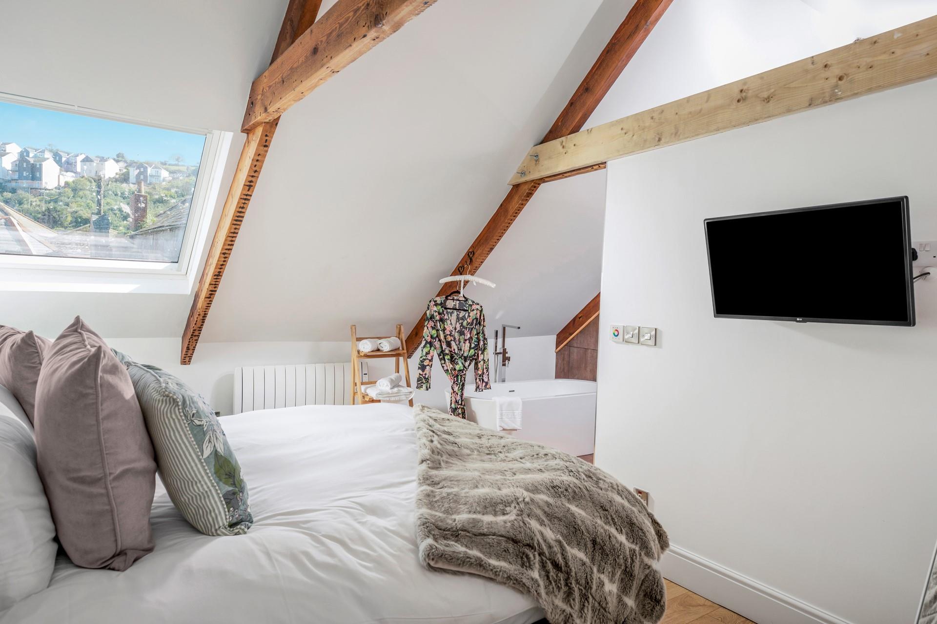 Indulge in true comfort and luxury in the uniquely designed bedroom with a semi-open bathroom and freestanding bathtub. 