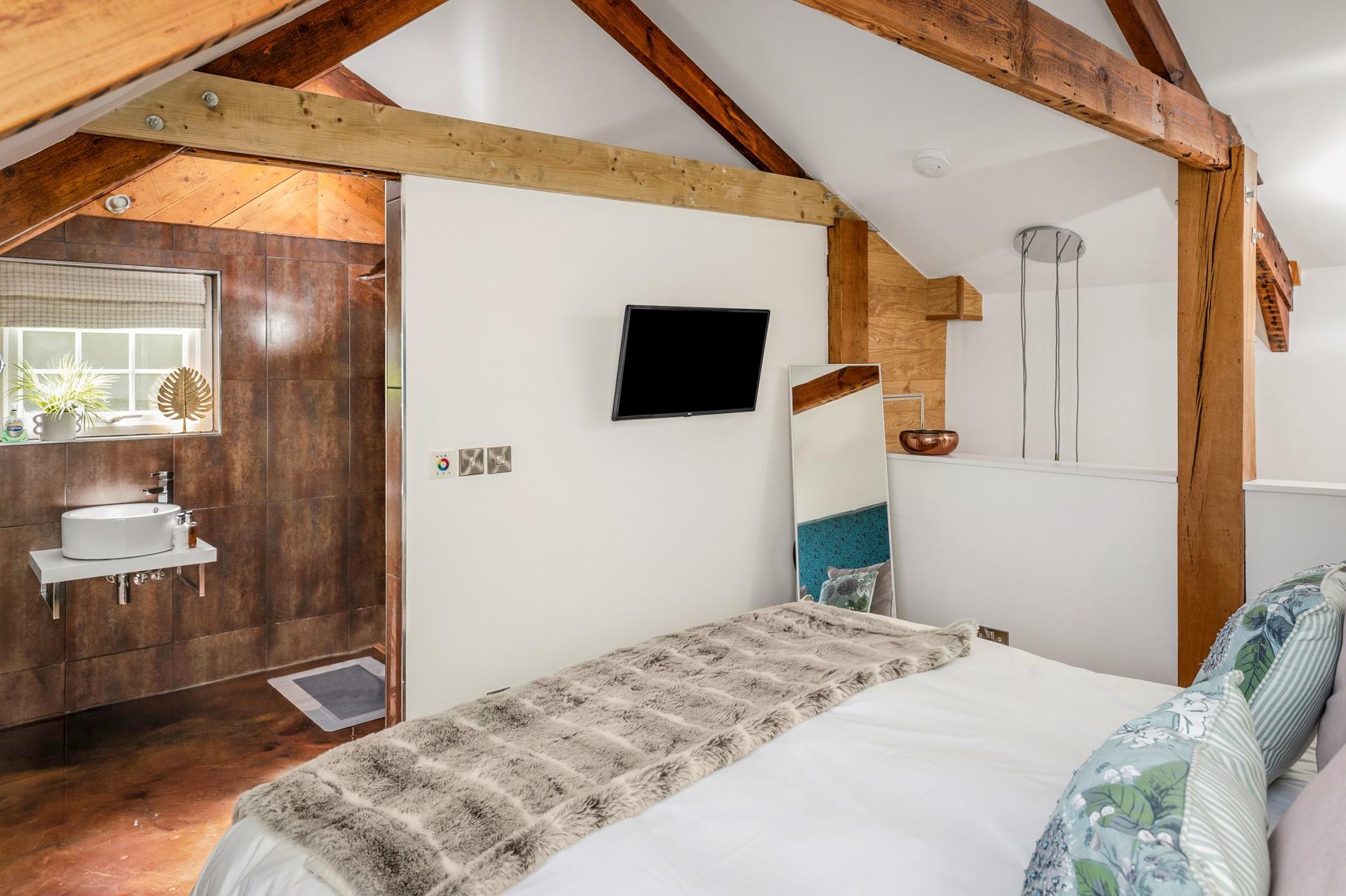 While one of you relaxes on the bed, the other can unwind in the bathtub, still close enough to share a conversation.