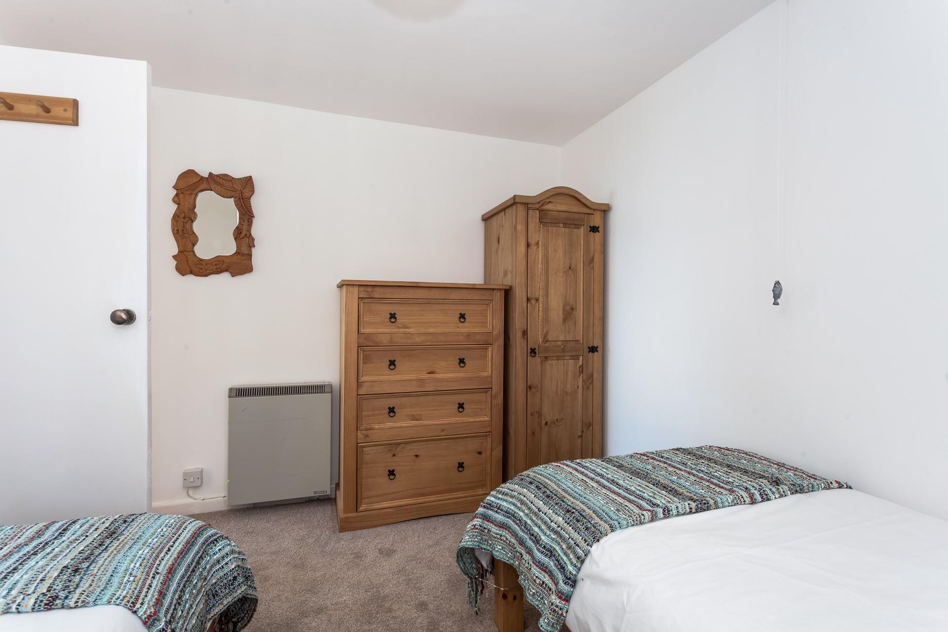 Sweet decor, muted colours and plenty of storage make this the ideal room for both children and young adults.