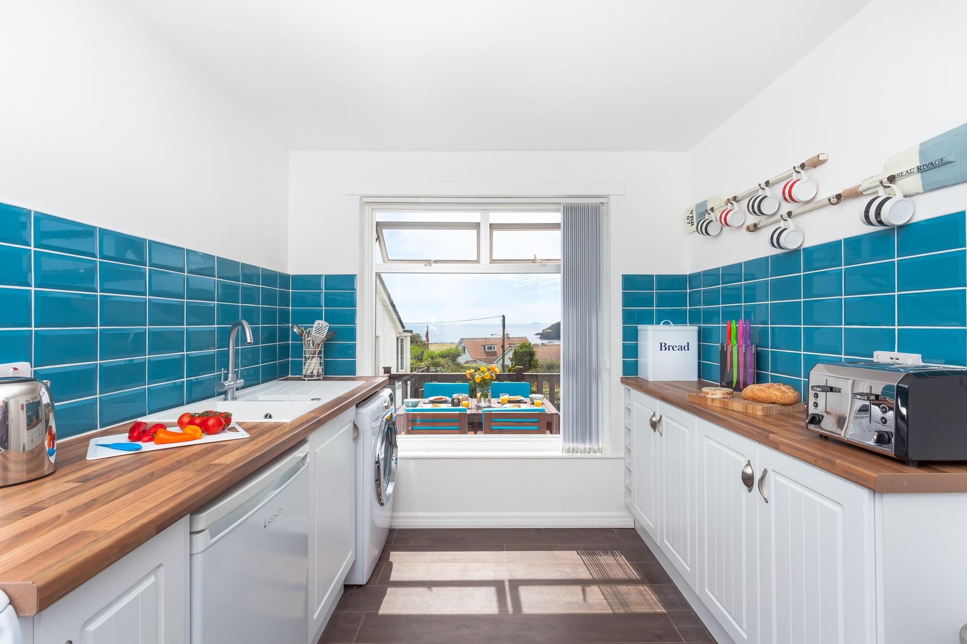 The cheerful kitchen is a lovely spot for cooking.