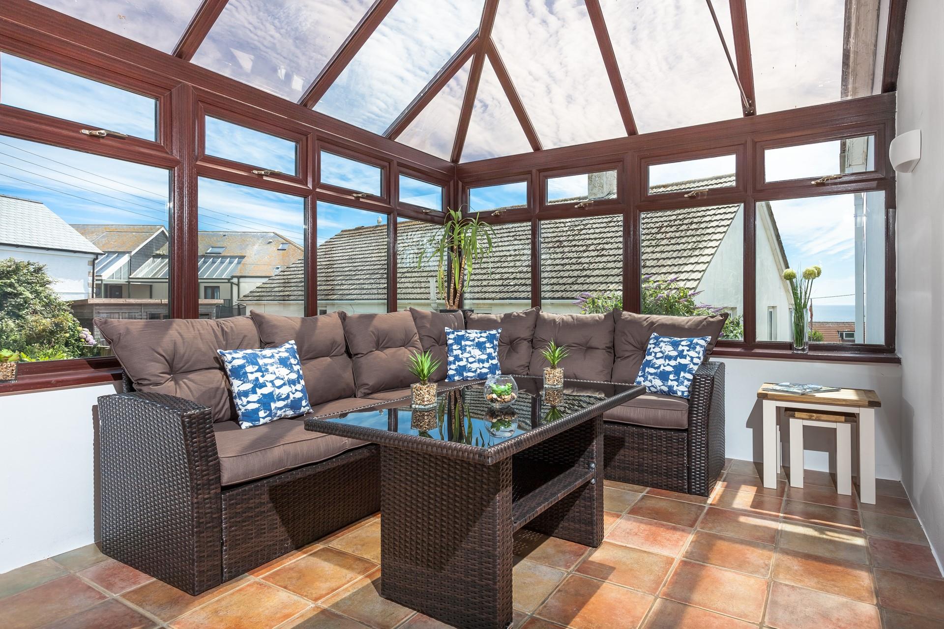  Relax with the family in the light and bright conservatory.