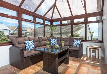  Relax with the family in the light and bright conservatory.