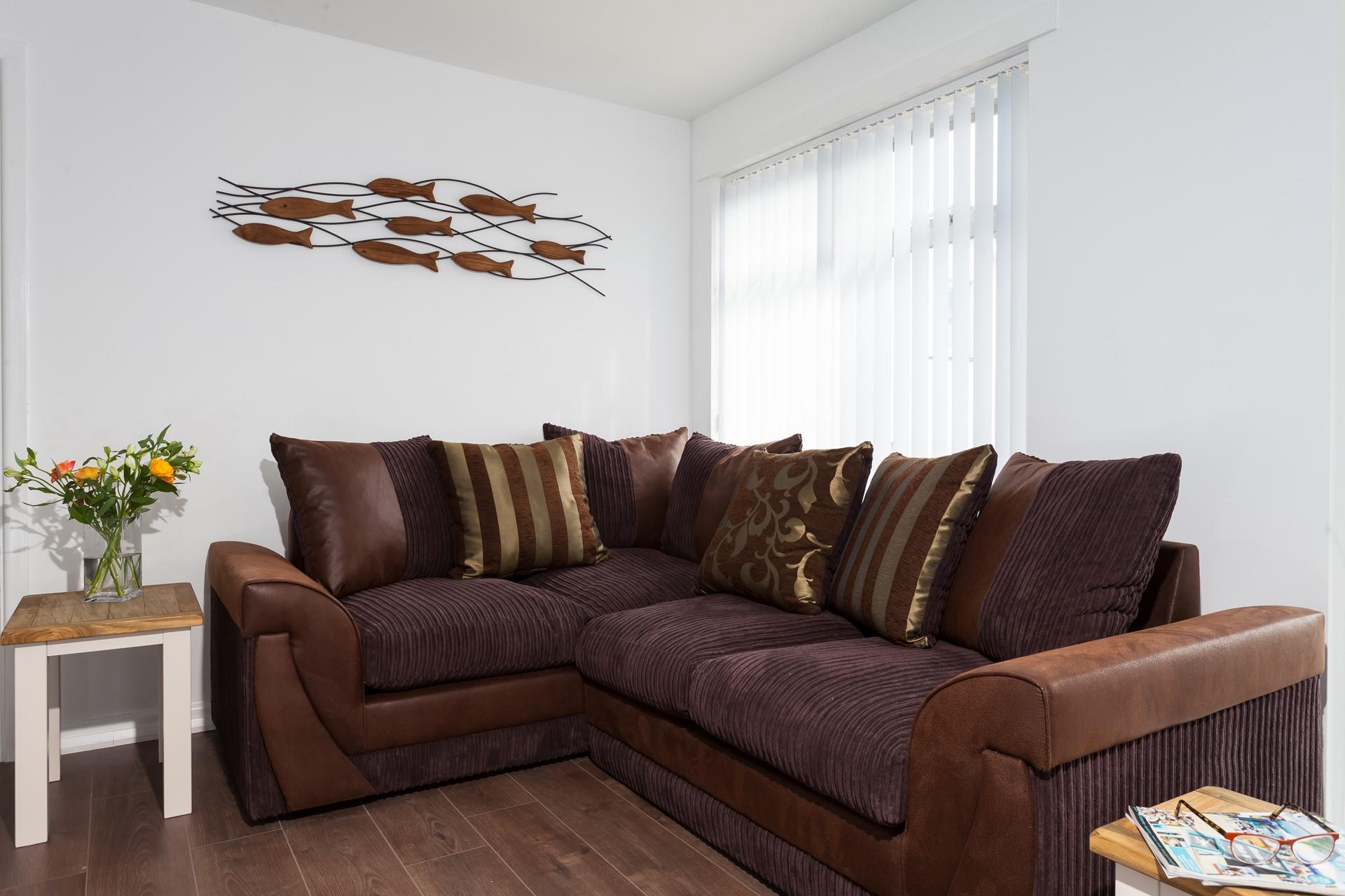 The comfortable sofa is perfect for the whole family to snuggle up on for a night of family favourite films!