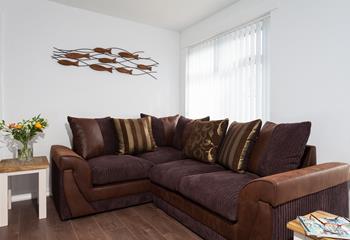 The comfortable sofa is perfect for the whole family to snuggle up on for a night of family favourite films!