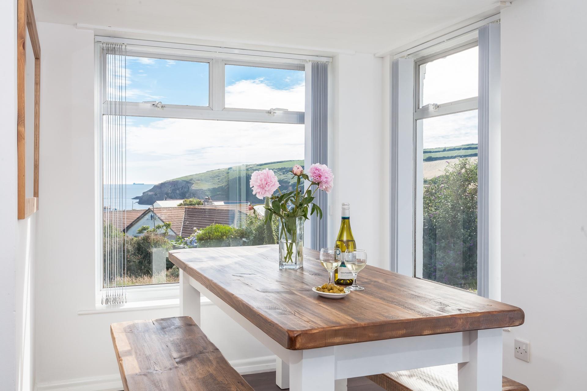 The striking, bench-style seating area is surrounded by large windows so you can indulge in the glorious views whilst you eat!