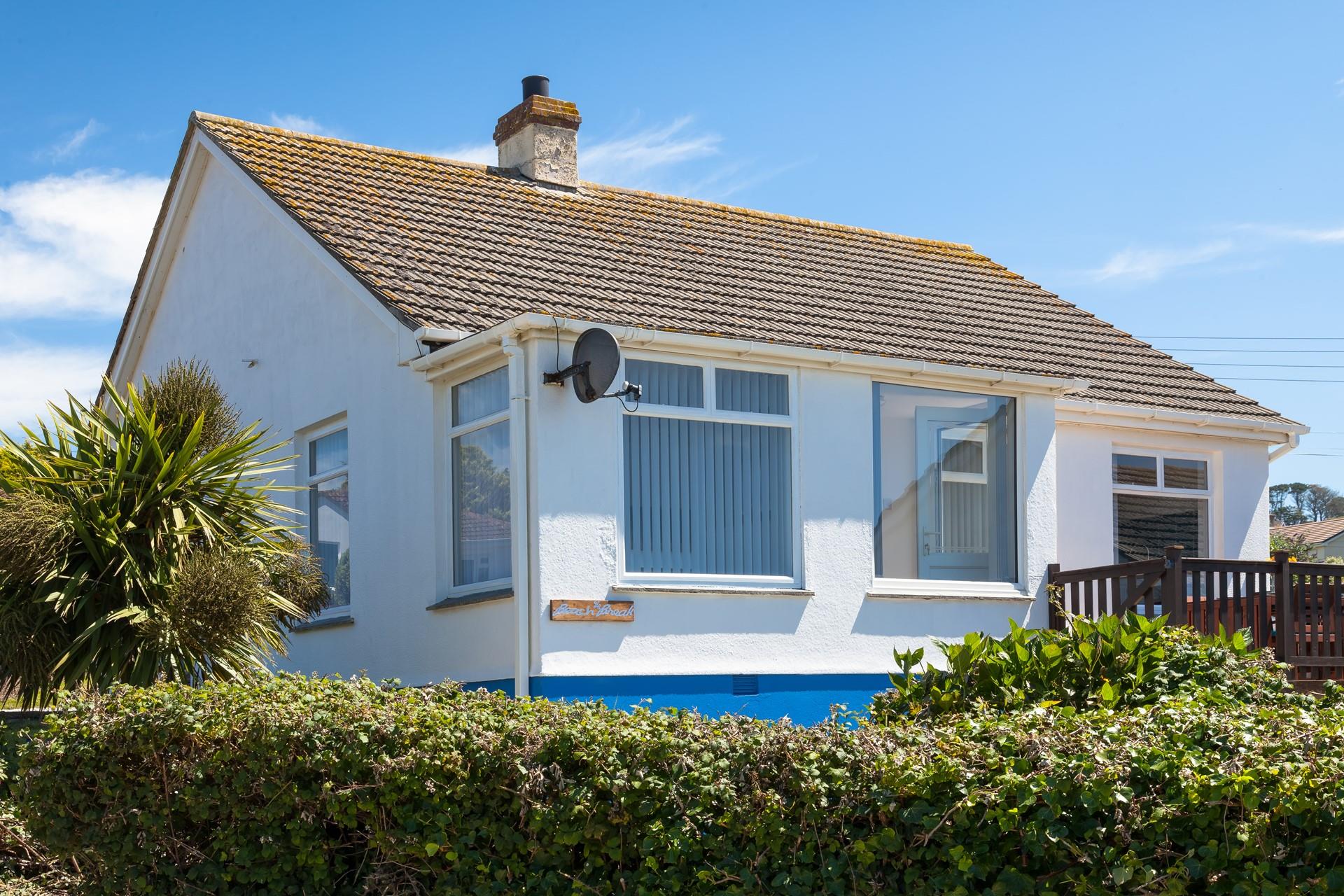 Large windows flood the property with natural light and showcase the postcard-worthy views.