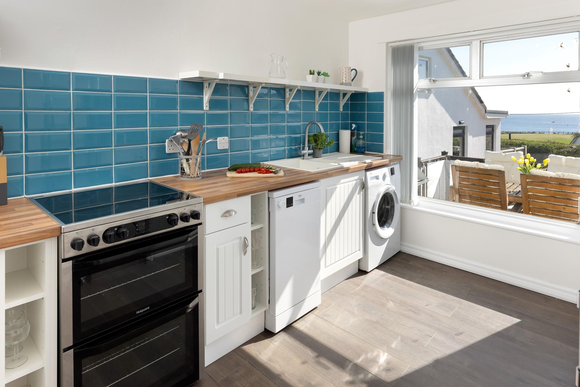 The spacious kitchen with modern appliances has everything you need to whip up delicious meals!