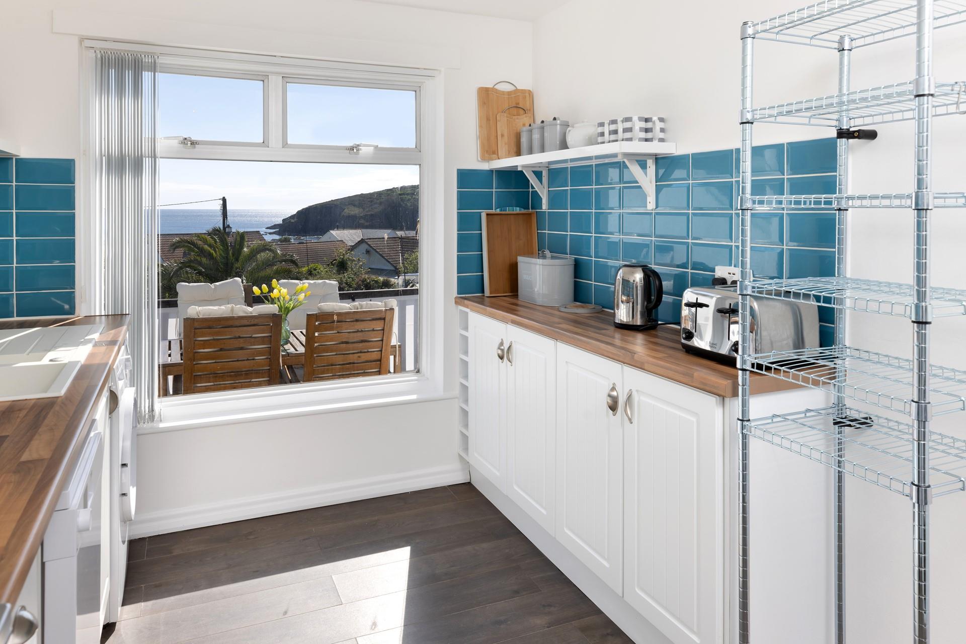 The bright kitchen is a lovely spot for cooking.
