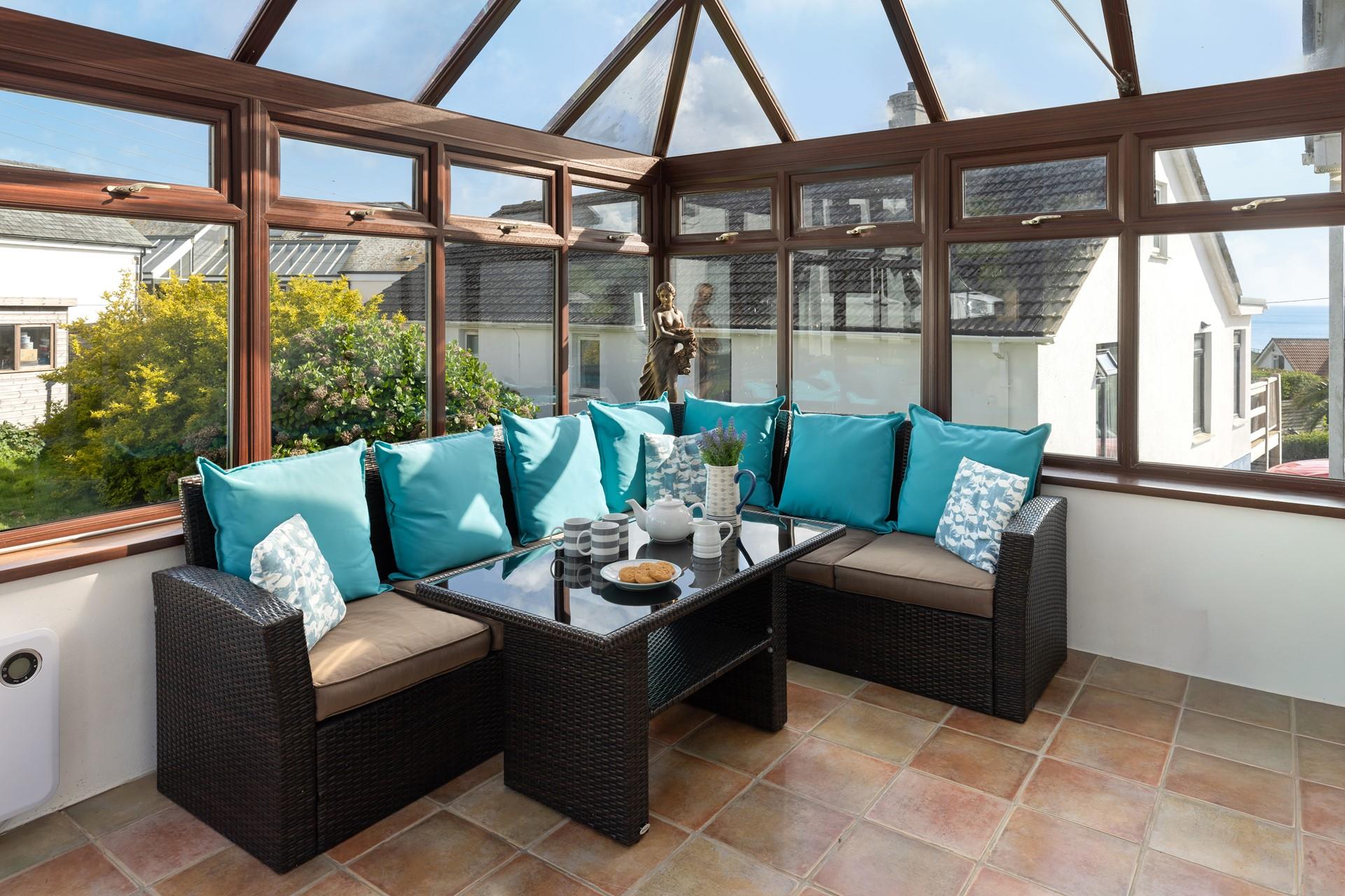  Relax with the family in the light and bright conservatory.