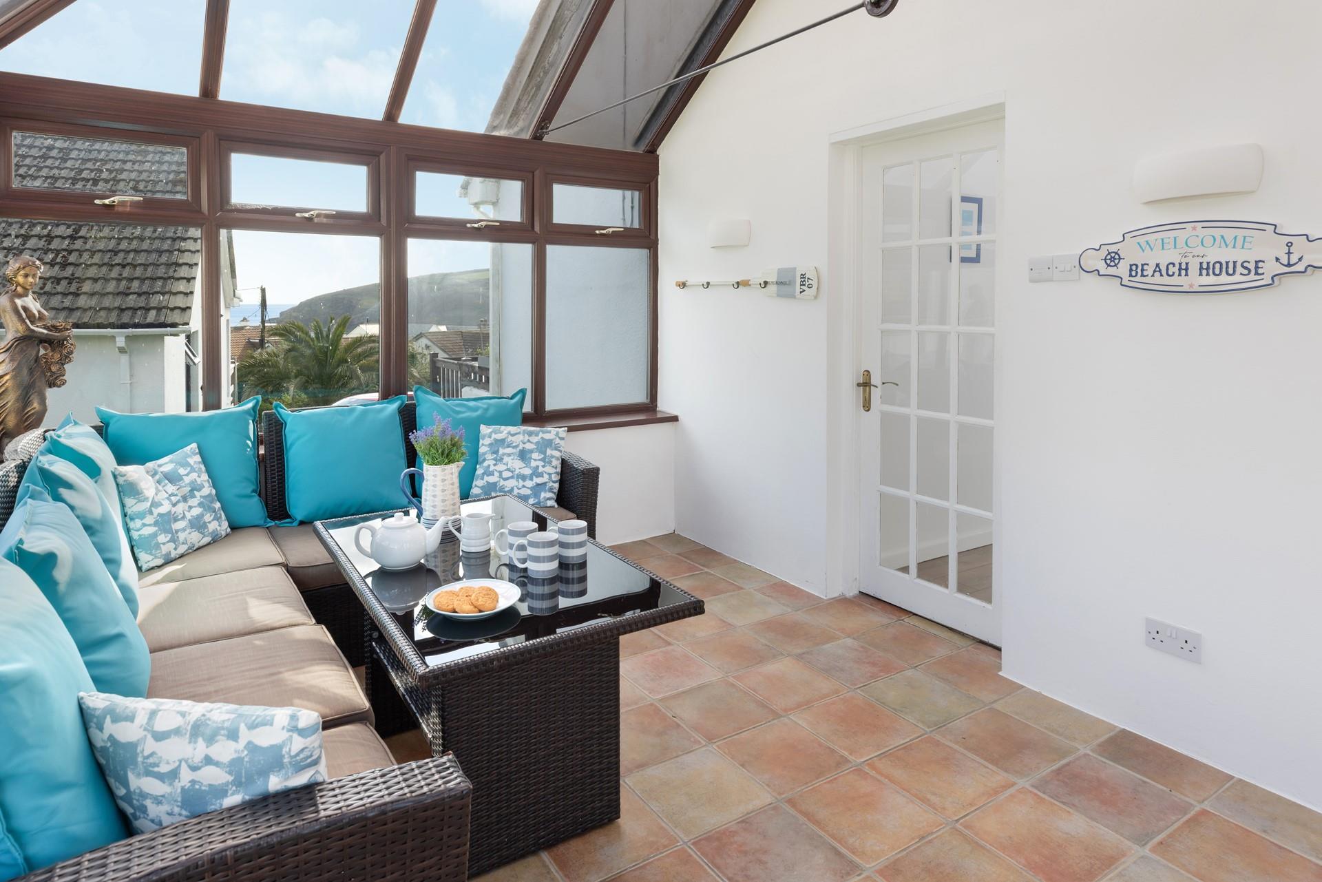 Enjoy breakfast in the conservatory whilst soaking up the sea views. 
