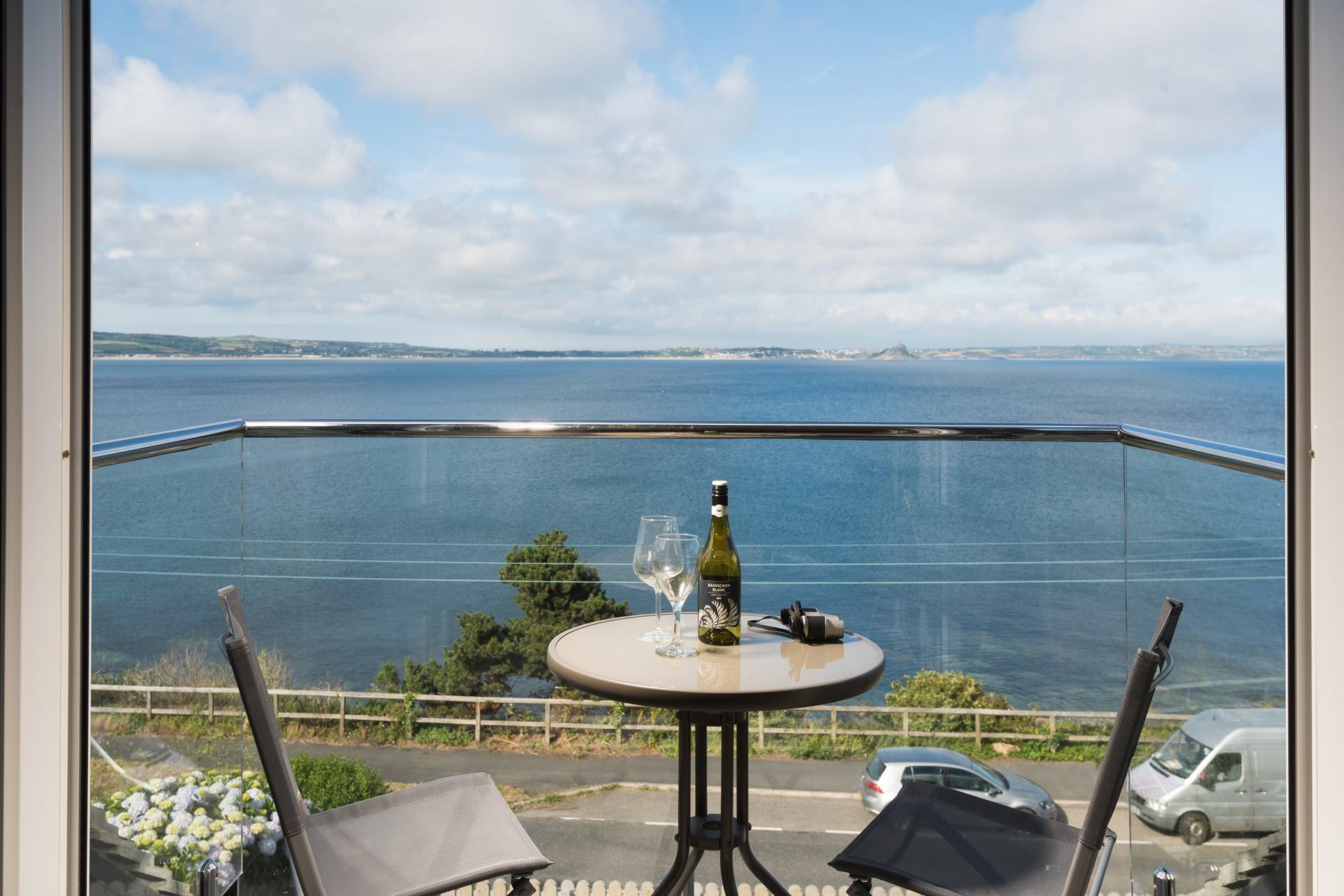 As the sun comes down on another day, sip a glass of your favourite wine on the balcony.