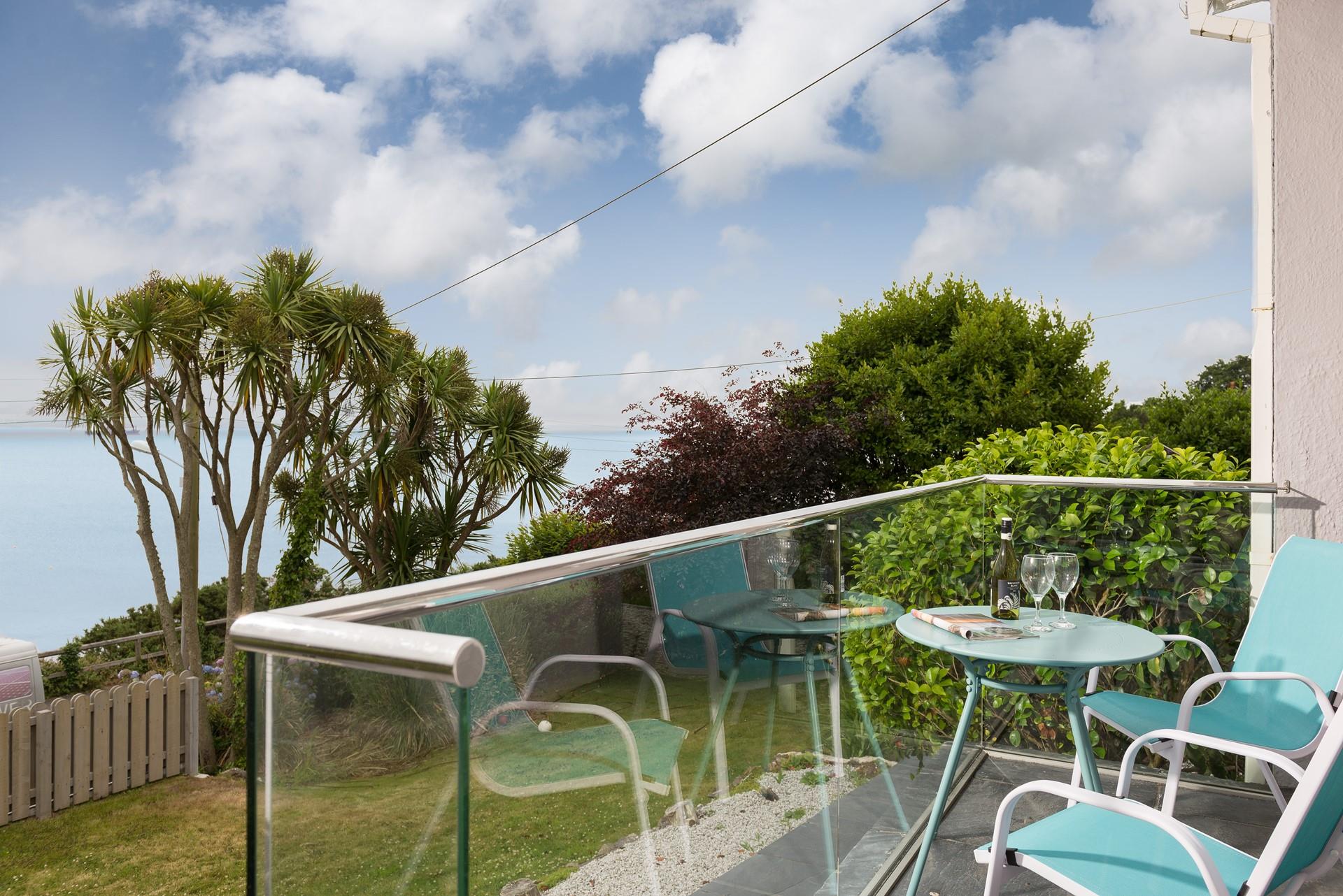 Enjoy a drink on the lower balcony in the afternoon sun.