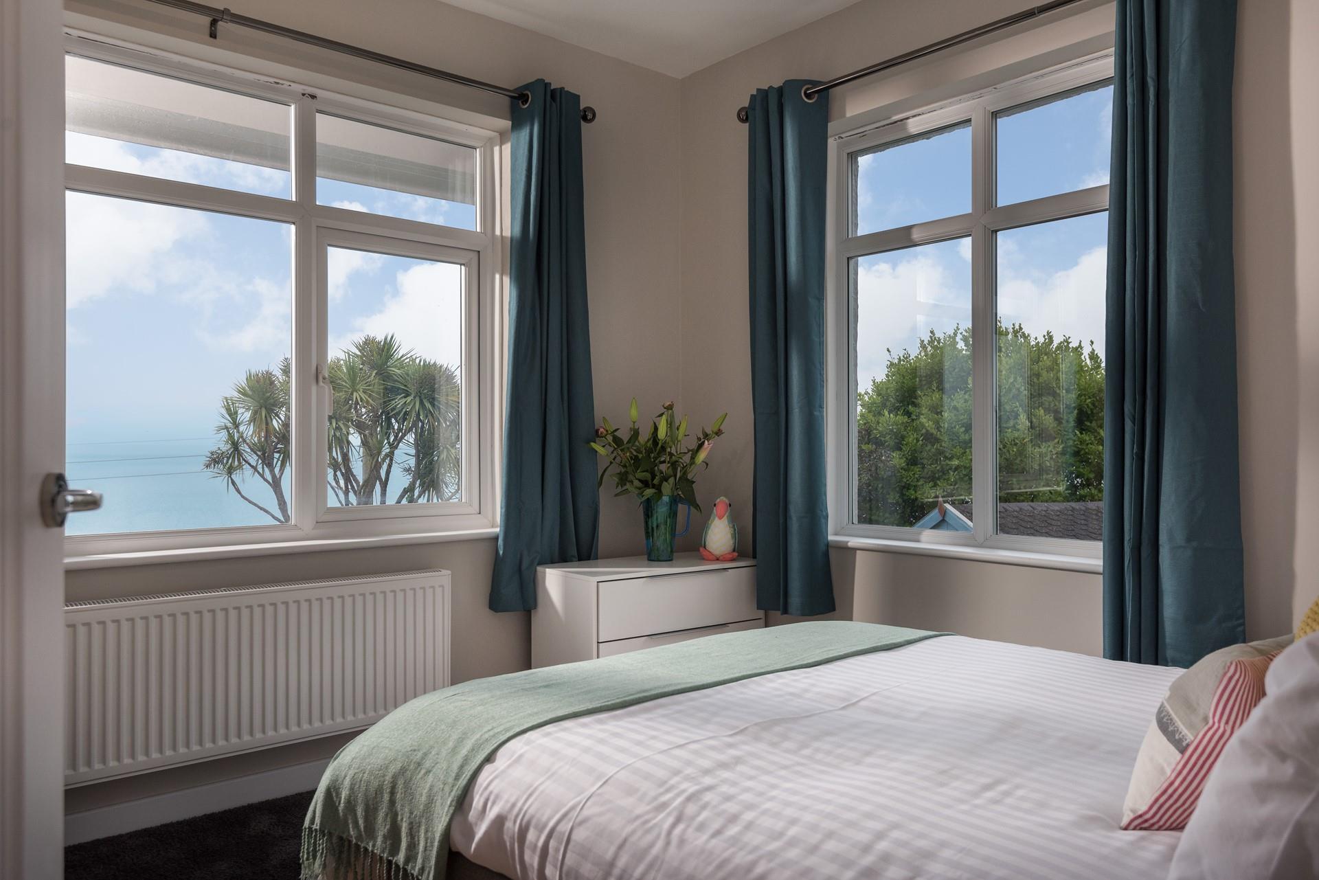 Bedroom 1 is on the ground floor and is perfectly decorated in calming blue and green tones.