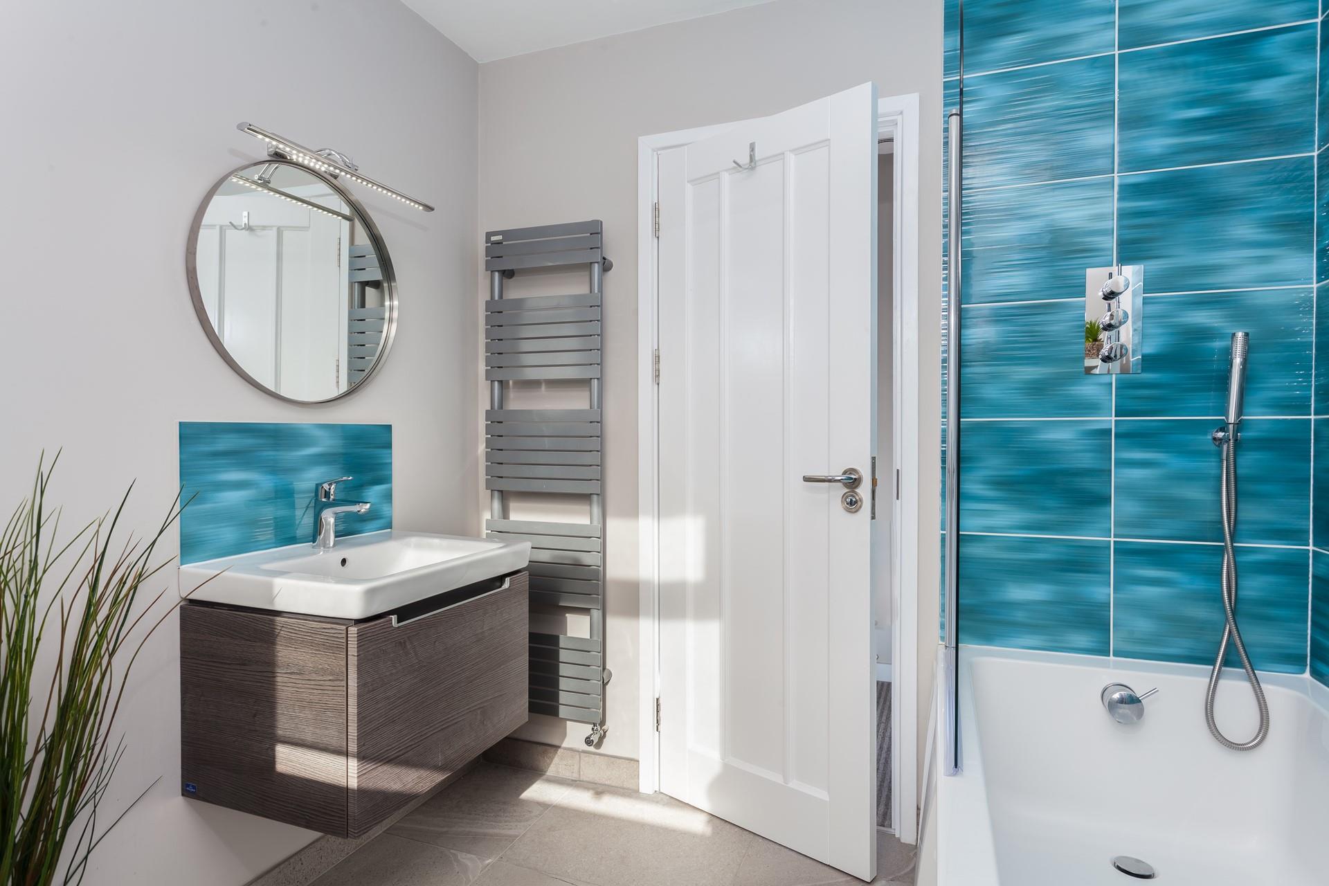 Warm fluffy towels can be taken straight from the heated towel rail after a relaxing bath.