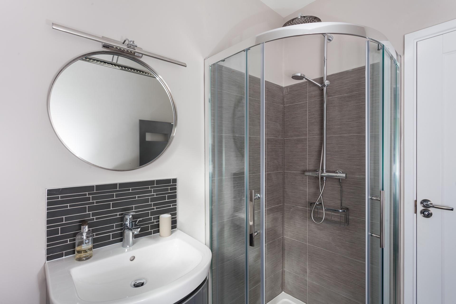 Wash off sandy toes in the shower after a day on the beach.