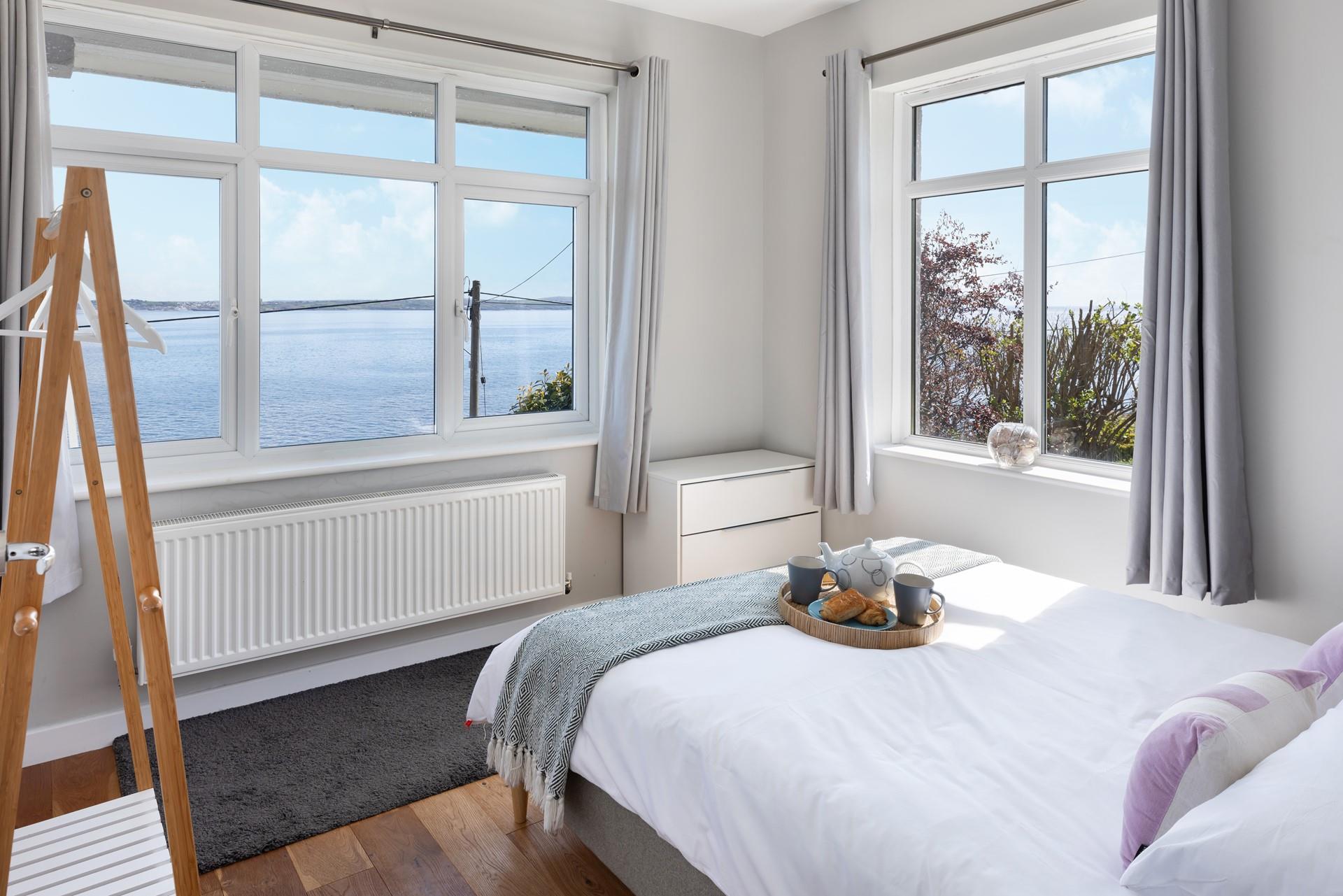 Watch the sun set from the comfort of the plush bed in bedroom 1. 