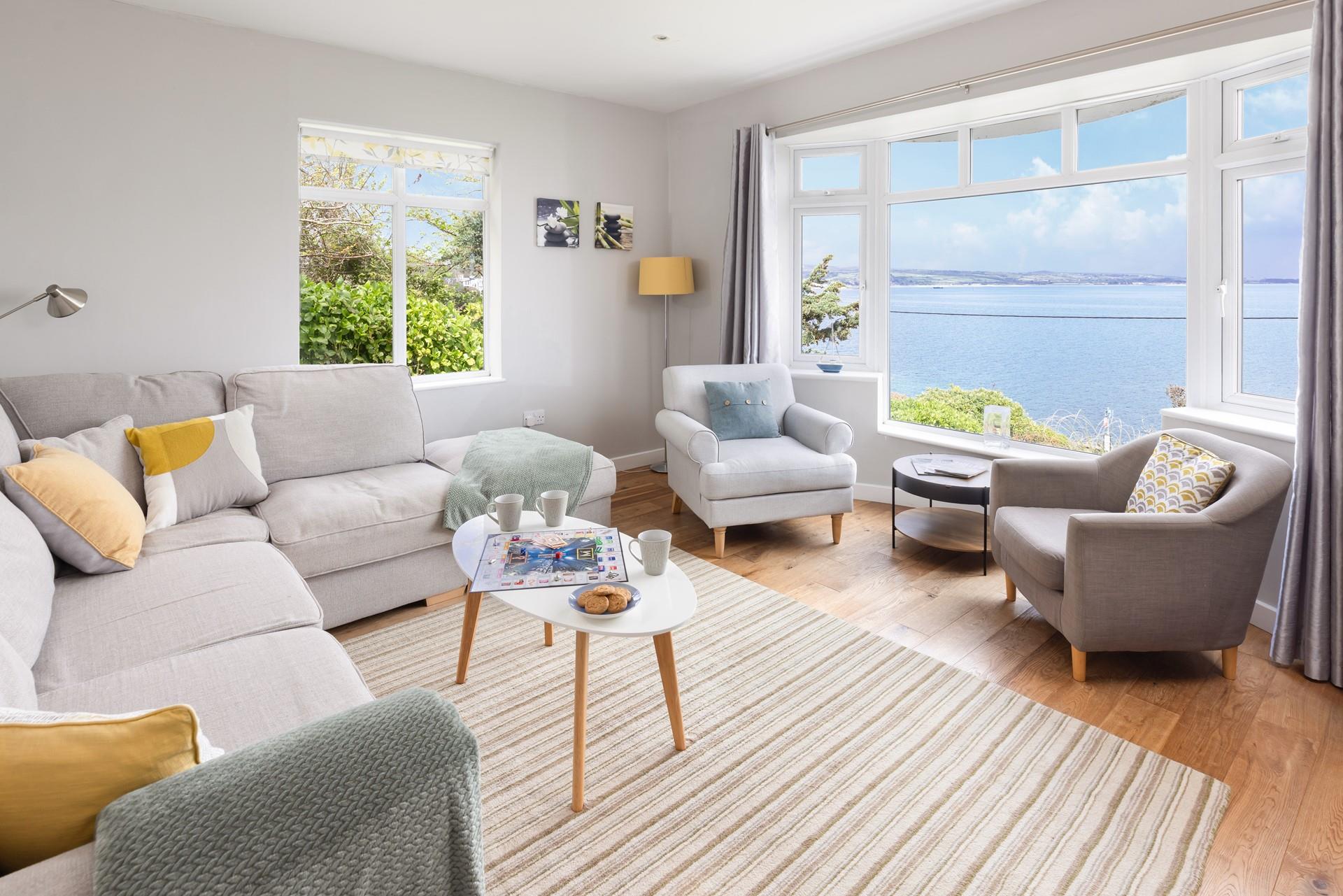 The cosy sitting room has captivating sea views to enjoy with the family.