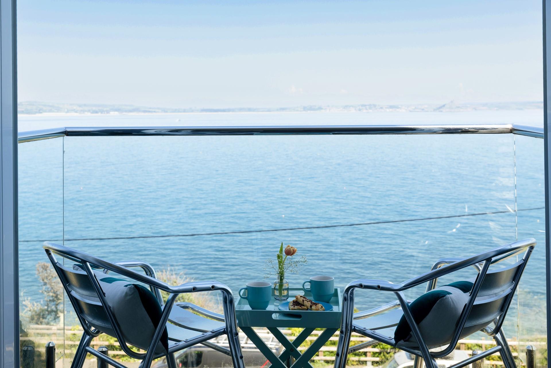 Enjoy a warm beverage as the sun comes up for another day in Cornwall.