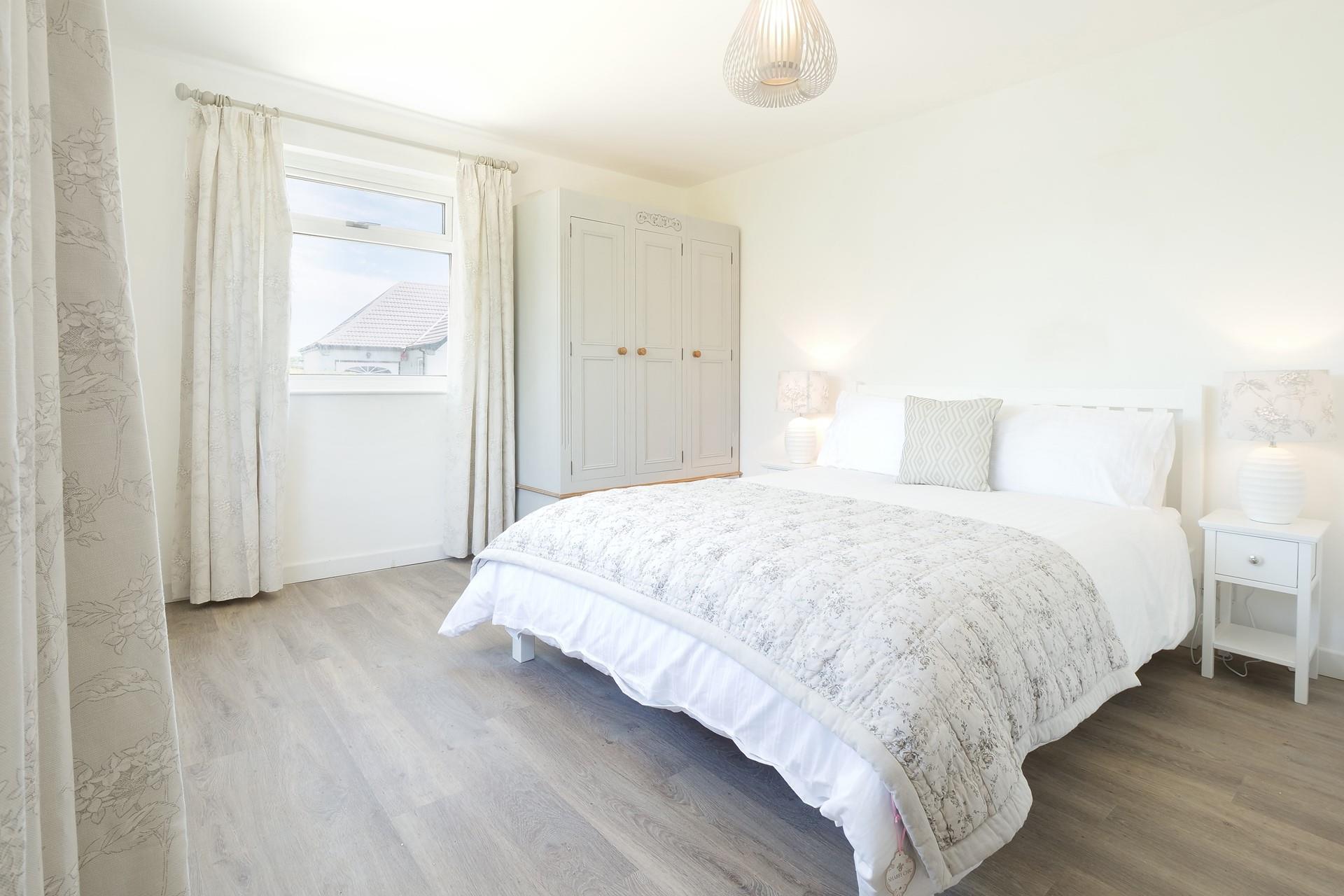 Bedroom 1 has a spacious king size bed for enjoying a dreamy night's slumber.