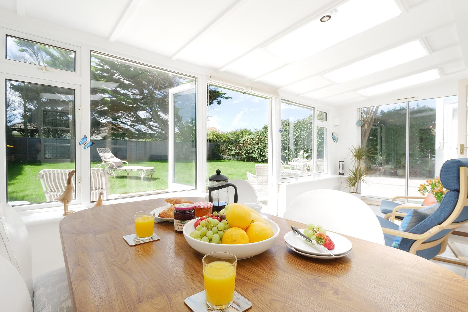 The sunroom is the perfect spot for tucking into breakfast before heading out.