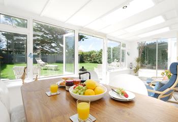The sunroom is the perfect spot for tucking into breakfast before heading out.