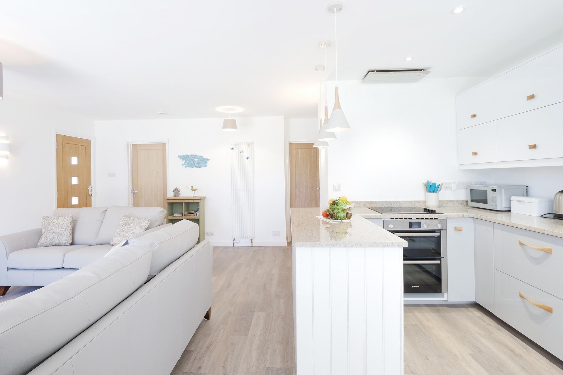 The kitchen is well-equipped with plenty of worktop space to cook tasty meals.