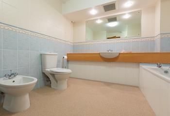 The spacious bathroom is perfect for a family of four. 
