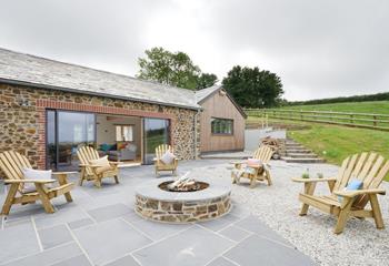 Huddle around the firepit, perfect for toasting marshmallows!