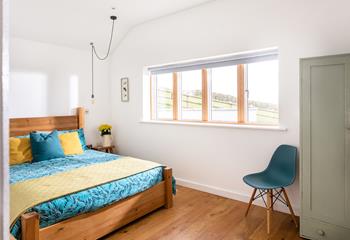 Enjoy a lazy morning in the comfy king size bed in bedroom 1, and take in the rural views on offer.