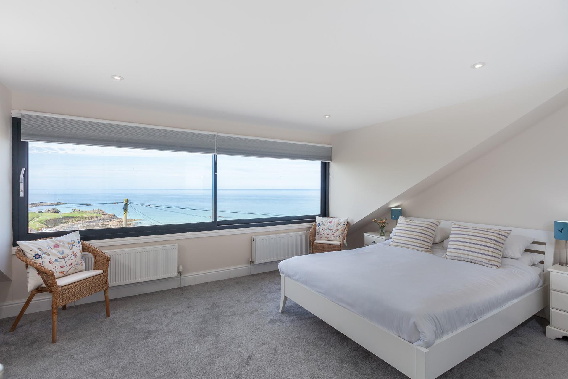 Wake up in the soft sheets and open the blinds to stunning sea views.